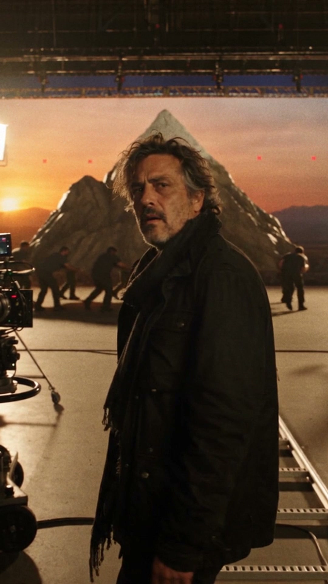 Director turning toward the camera on a mountain film set